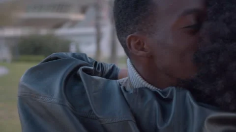 Romantic black couple hugging and kissing outdoors Stock Footage 339790680