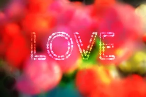 Romantic bokeh blurred background of reds pink yellow green and soft colors w Stock Photos