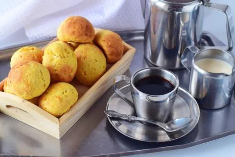 Romantic breakfast. Coffee set, fresh biscuits on a silver tray. Stock Photos