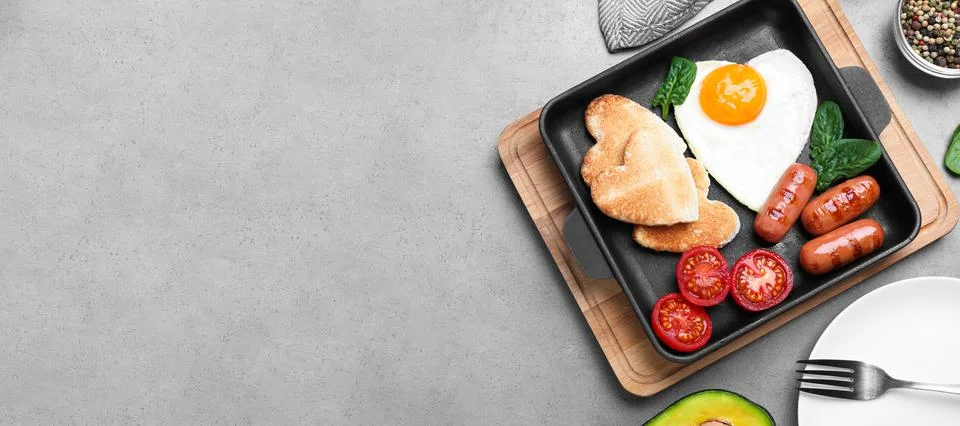 Romantic breakfast on grey table, flat lay with space for text. Valentine's d Stock Photos