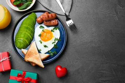 Romantic breakfast on grey table, flat lay with space for text. Valentine's d Stock Photos