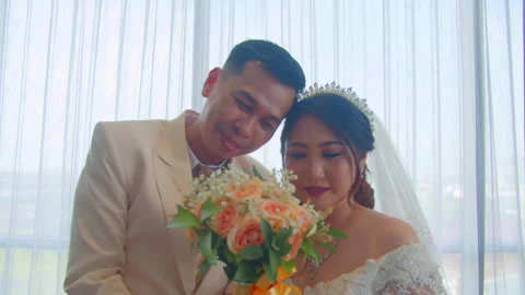 Romantic Bride and Groom Leaning In with Bouquet in Wedding Moment Stock Footage 333365414
