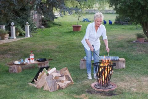 A romantic campfire also includes grilled sausages Stock Photos