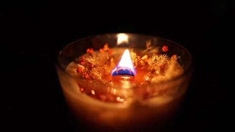 Romantic candle burning in the dark Stock Footage 258416517