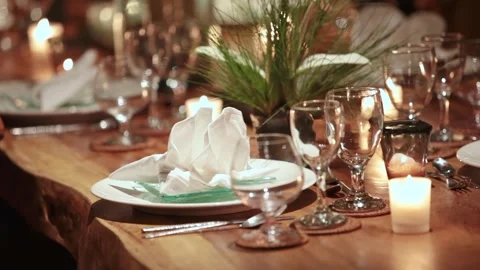 Romantic Candlelight Dinner Table Setting on Luxury Wooden Table at Night Stock Footage 339555320