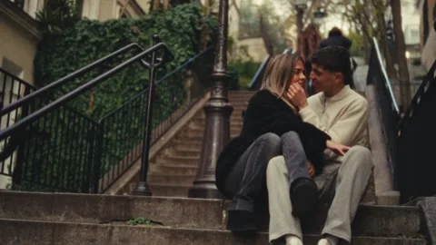 Romantic City Trip Concept Couple In Love Sitting On Steps In Paris Super 8 Film Video stock 330093570