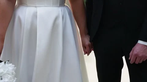 Romantic Close-Up of Bride and Groom Holding Hands on Wedding Day Stock Footage 343432985
