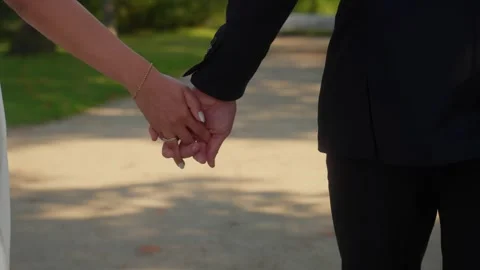 Romantic Close-Up of Couple Holding Hands Outdoors 스톡 동영상 331010629