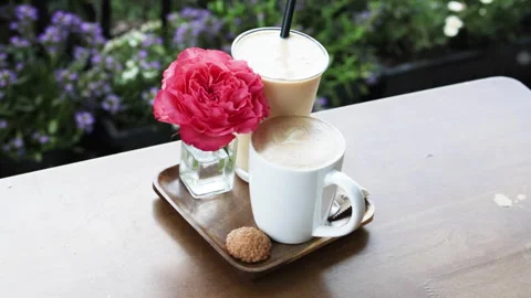 Romantic coffee break with a rose and a cookie. Stock Footage 277134739