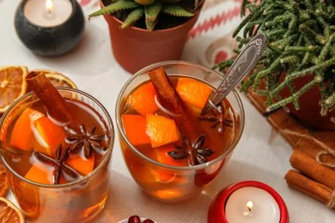 Romantic composition with two cups of tea with orange, anise and cinnamon Stock Photos