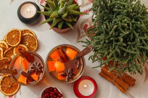 Romantic composition with two cups of tea with orange, anise and cinnamon Stock Photos
