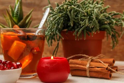 Romantic composition with two cups of tea with orange, anise and cinnamon Stock Photos