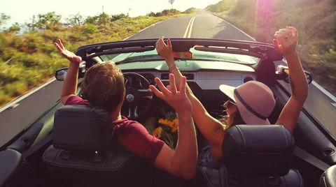 Romantic Convertible Drive into Sunset Stock Footage 53348997