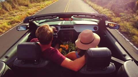Romantic Convertible Drive into Sunset Stock Footage 53349977