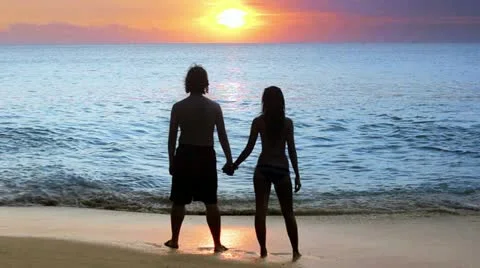 Romantic couple at beach during sunset Stock Footage 12170452