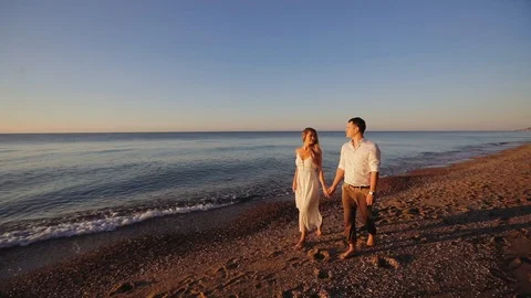 Romantic couple on the beach Stock Footage 92096999