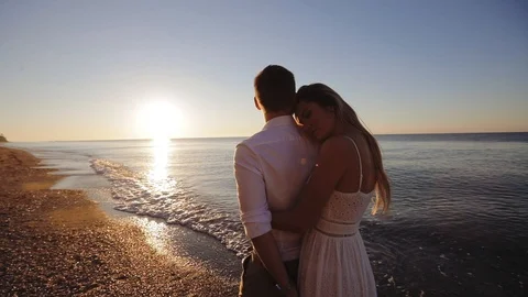 Romantic couple on the beach Stock Footage 92097051