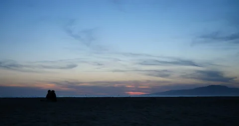 Romantic couple beach sunset two Stock Footage