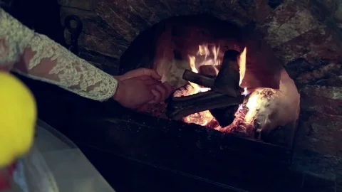 Romantic couple in bed in front of the fireplace Stock Footage 72354171