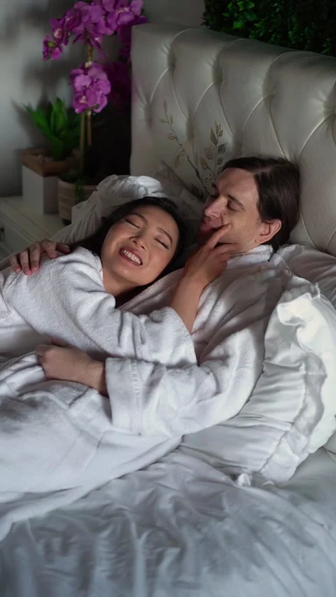 Romantic Couple in Bed Sharing Tender, Loving Moment Filled with Affection Video stock 291625319