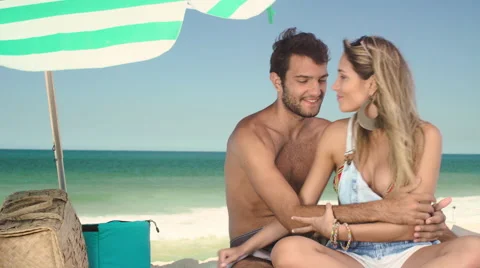 Romantic couple cuddling on beach Stock-Footage 59441774