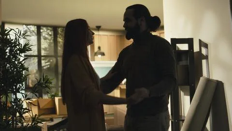 Romantic couple dancing and hugging indoors after finishing relocation Stock Photos