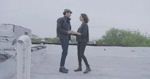 Romantic Couple Dancing Casually On Roof 2 Stock Footage 94446341