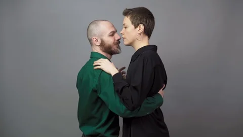 Romantic couple dancing on gray background. Man and woman are dancing slow blues Video stock 124431963