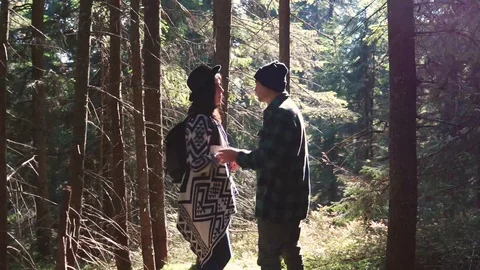 Romantic couple dancing salsa in mountains. Bachata. Sun rays in the forest.  動画素材 120239087