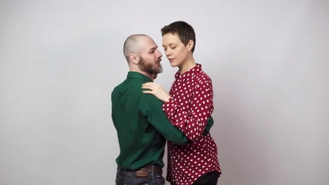 Romantic couple dancing on white background. Man and woman are dancing slow Video stock 124317090