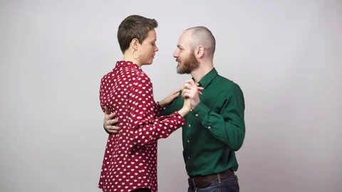 Romantic couple dancing on white background. Man and woman are dancing slow Stock Footage 124317165