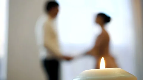 Romantic couple dancing by the window Video stock 103423314