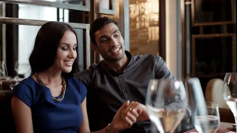 Romantic couple drinking wine at restaurant. Stock Footage 119384810