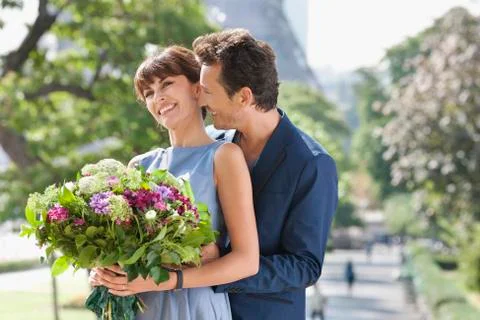 Romantic couple with the Eiffel Tower in the background, Paris, Ile-de-France, Stock Photos