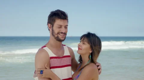 Romantic couple embracing on beach 库存影片 49613899