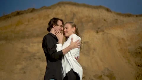 A Romantic Couple Embracing Each Other Outdoors Against the Beautiful Sunset Stock Footage 282104933