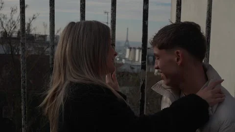 Romantic couple embracing with Eiffel Tower view in Paris France Young woman Stock Footage 325232648