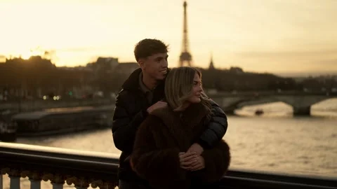 Romantic couple embracing with Eiffel Tower view in Paris France at sunset Stock Footage 325242581