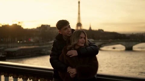 Romantic Couple Embracing with Eiffel Tower View in Paris France at Sunset Stock Footage 325249138