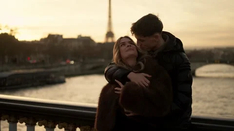 Romantic Couple Embracing with Eiffel Tower View in Paris France at Sunset Young Stock Footage 325253301
