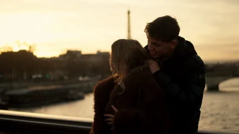 Romantic couple embracing with Eiffel Tower view in Paris France at sunset Stock Footage 325264873