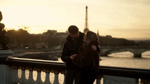 Romantic couple embracing with Eiffel Tower view in Paris France at sunset Stock Footage 325275347