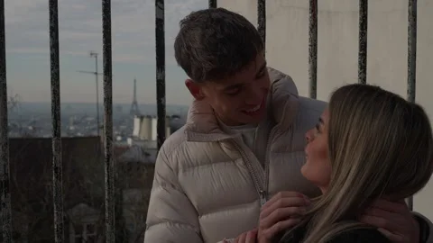 Romantic couple embracing with Eiffel Tower view in Paris France Young lovers Stock Footage 328567042