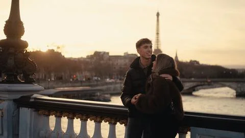 Romantic Couple Embracing With Eiffel Tower View In Paris France At Sunset Lo Stock Photos