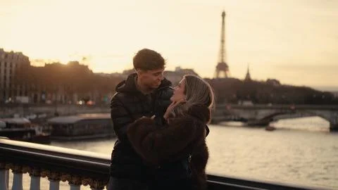 Romantic Couple Embracing With Eiffel Tower View In Paris France At Sunset Lo Stock Photos