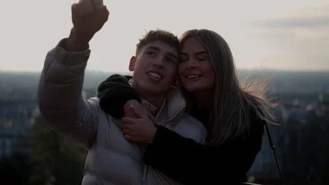 Romantic Couple Embracing Overlooking Paris Cityscape at Sunset France Stock Footage 325269786