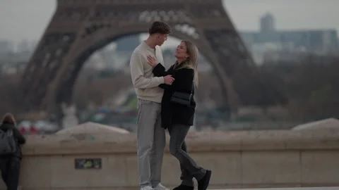 Romantic Couple Embracing in Paris with Eiffel Tower Background Loving Man and Stock Footage 325268932