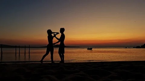 Romantic Couple Embracing at Sunset Beach Silhouette Video stock 335522586