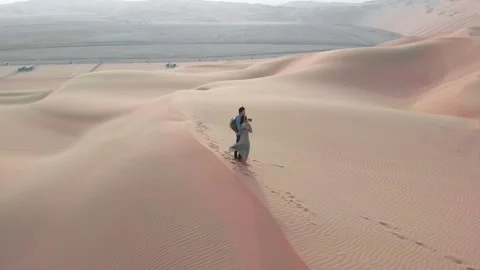 Romantic Couple in an Empty Desert at Sunset Video stock 316224872
