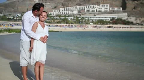 Romantic couple enjoying beach holiday HD Stock Footage